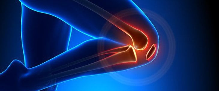 A glowing 3D illustration of a knee joint with highlighted red areas, indicating pain or inflammation.